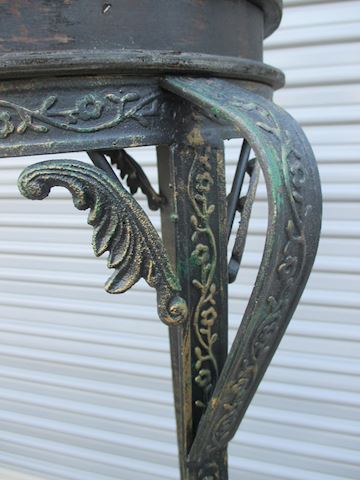 A set of Wicker and Wrought Iron Plant Stands