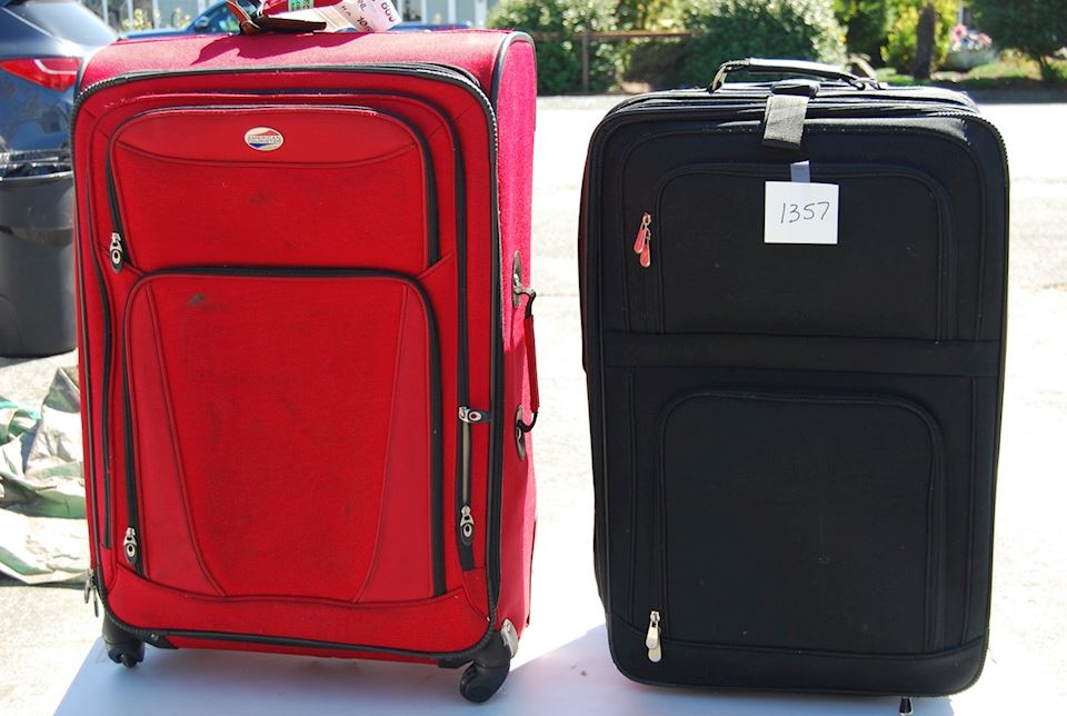 red and black suitcase