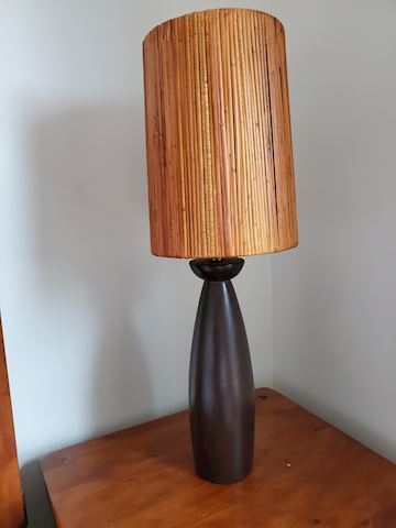 Tall wood lamp with reed natural shade
