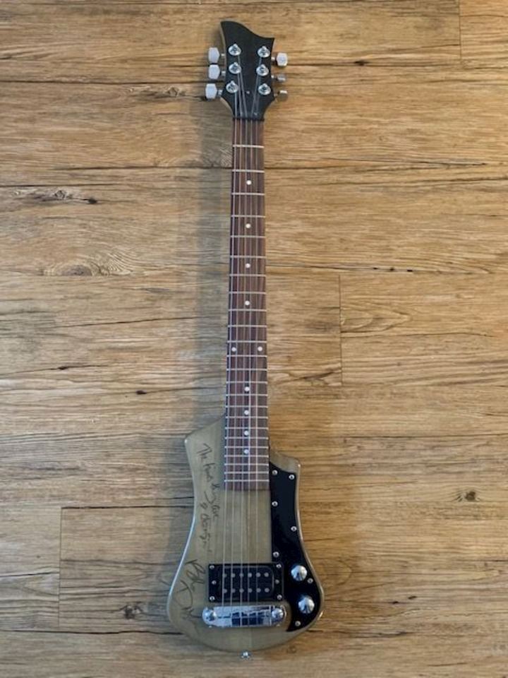 Busy Bee: Selling Signed Guitars for Ann's Chicken Fry House