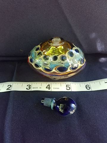 Beautiful golden egg shaped signed perfume bottle