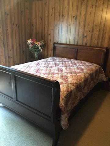 Dark wood sleigh bed